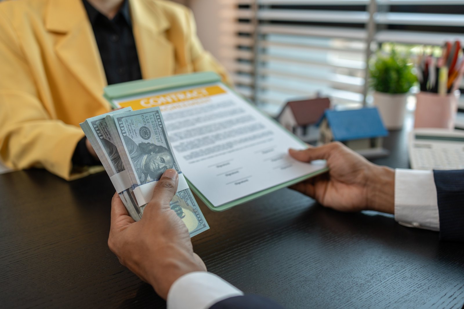 the buyer or renter is placing a deposit money with the real estate agent after signing